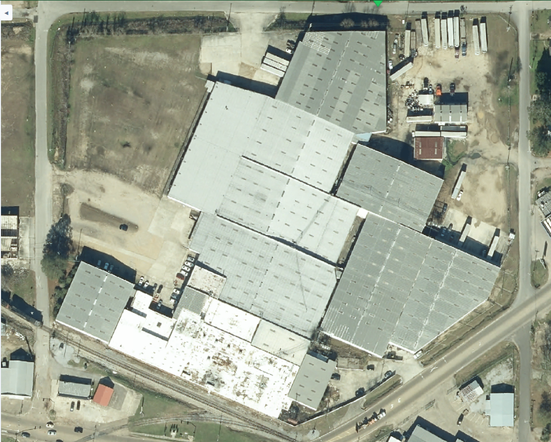 High-resolution aerial view of industrial building and parking areas
